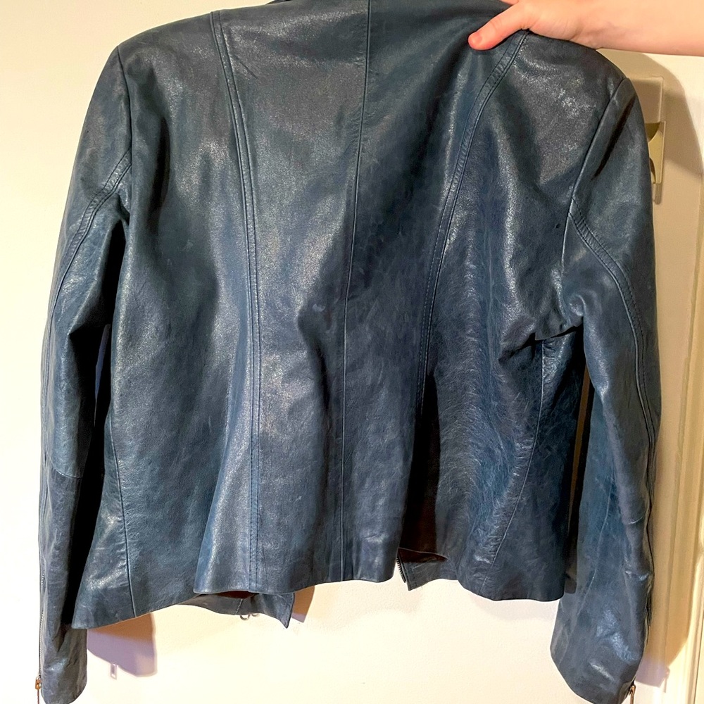 Tailored dusty blue leather jacket.